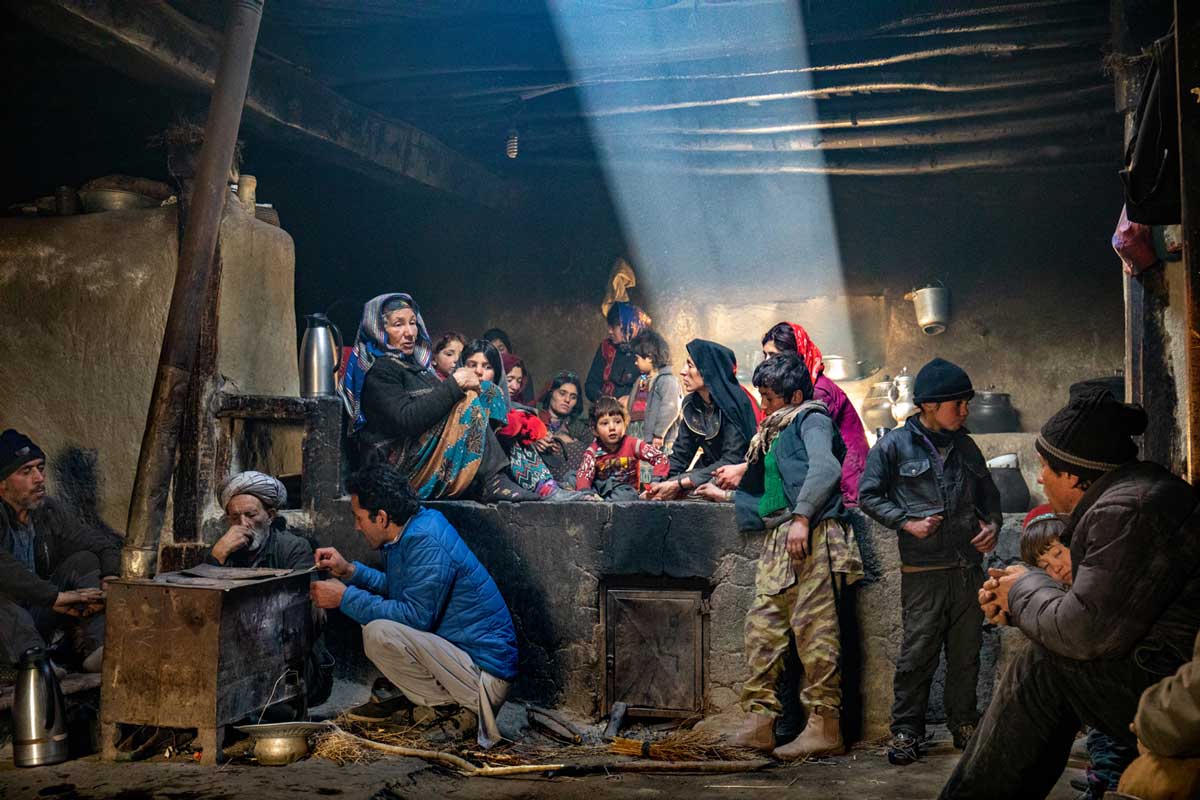 Family eating in a traditional kitchen, Afghanistan