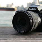 Panasonic LUMIX S5II on a bridge in front of a blue river
