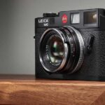 Leica M6 camera with limited edition 35mm Summicron lens on wooden table
